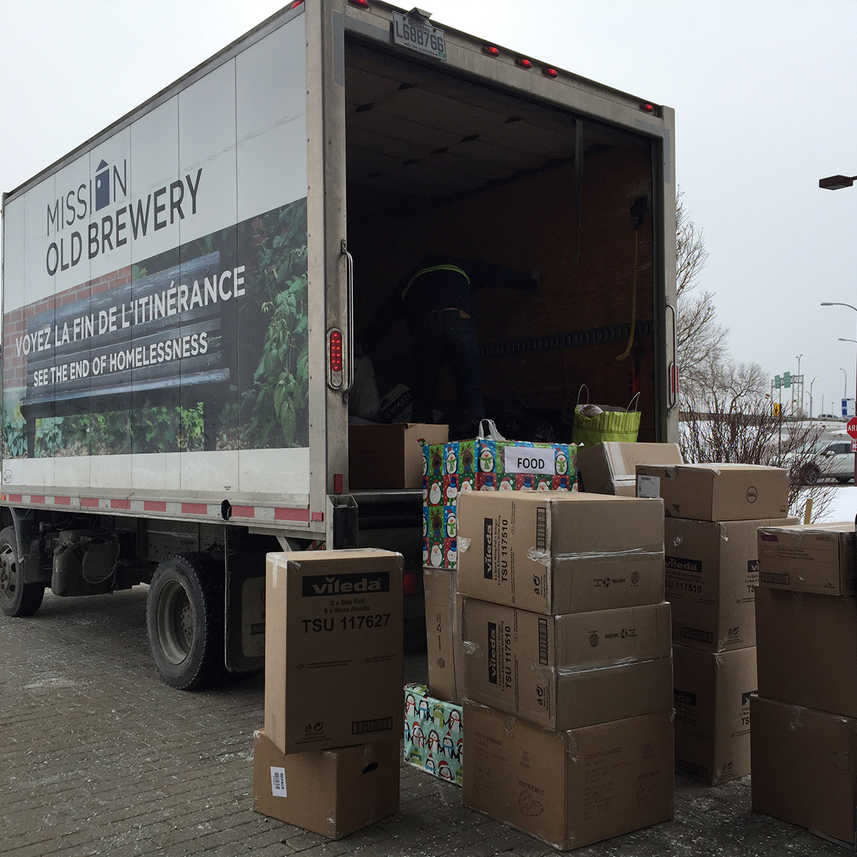 Unloading donations from an old Mission Brewery truck in Montreal