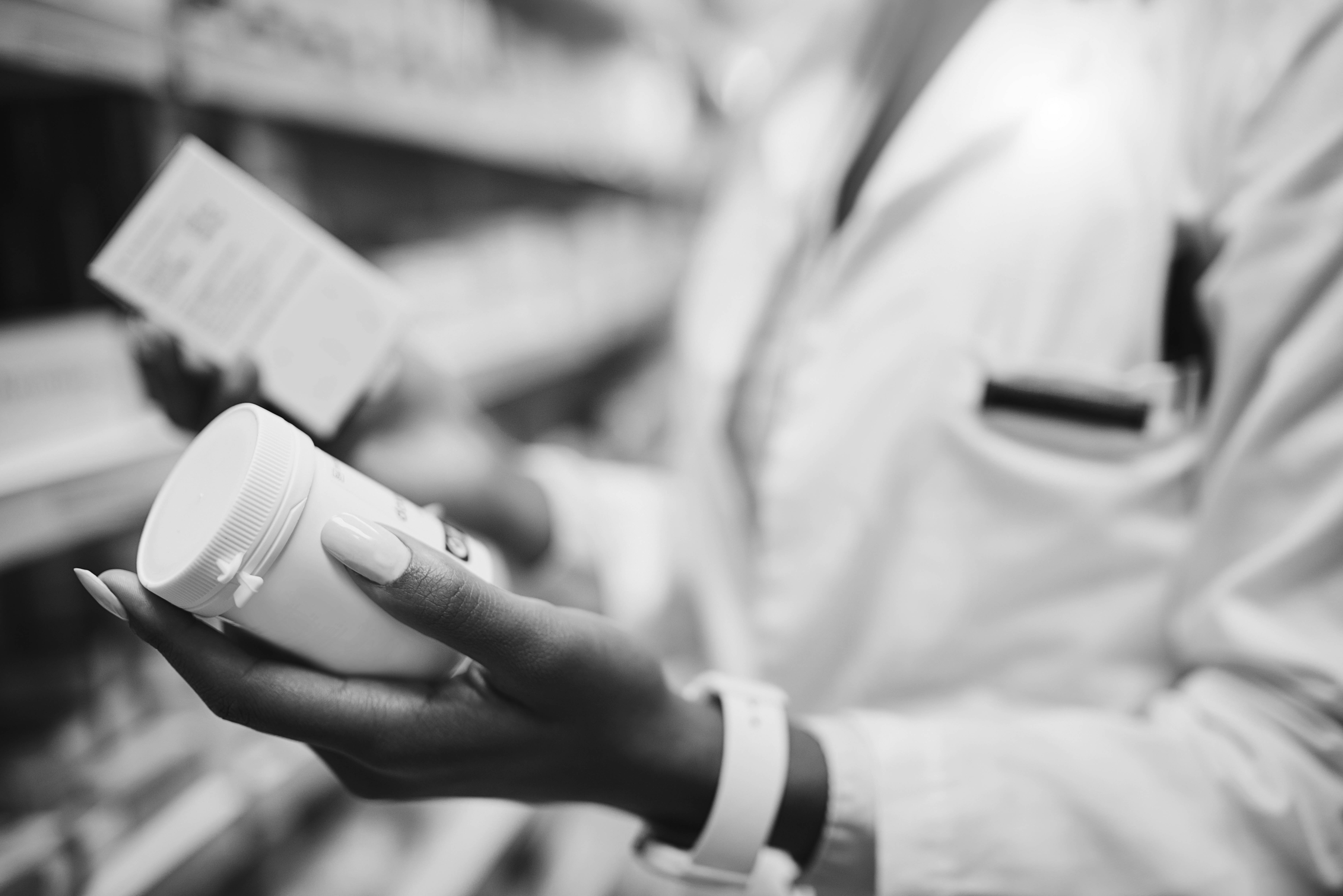 bottom banner_ pharmacist with medication_bw