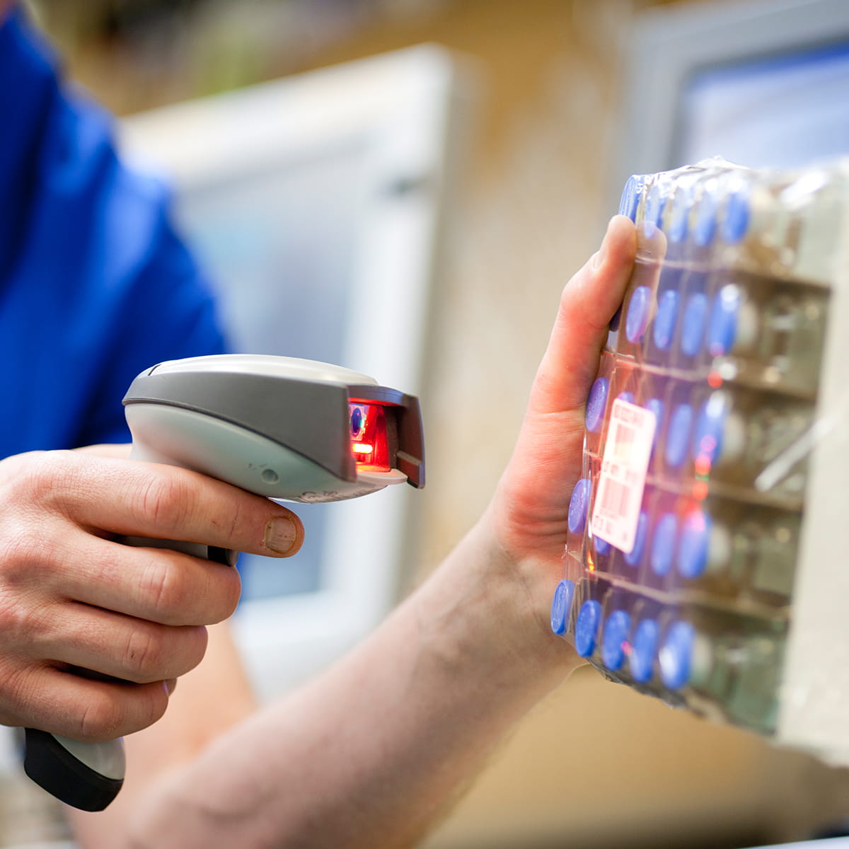 Employee electronically scans package of product